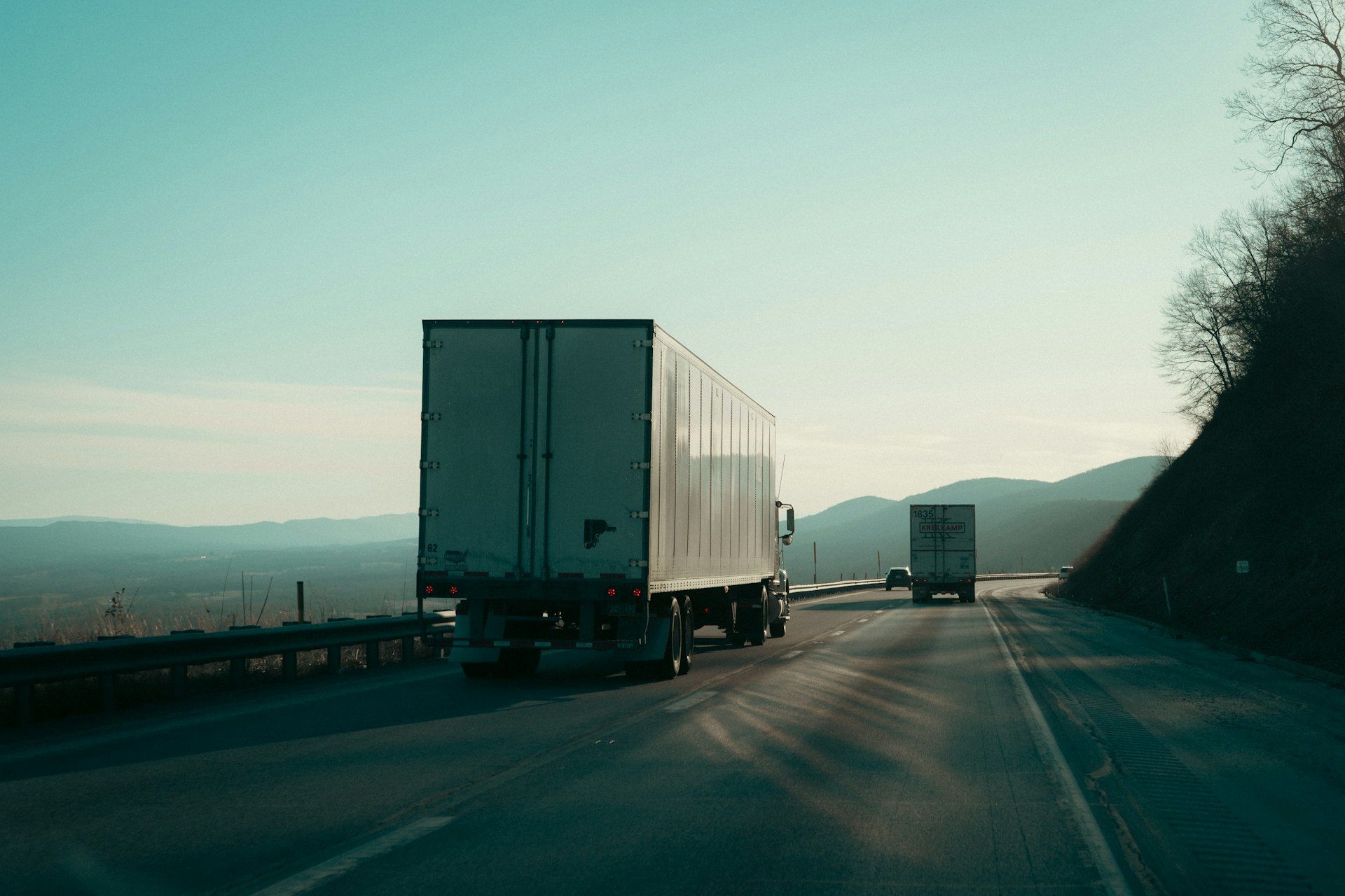 New Link Express trucks running a freight lane through the mountains