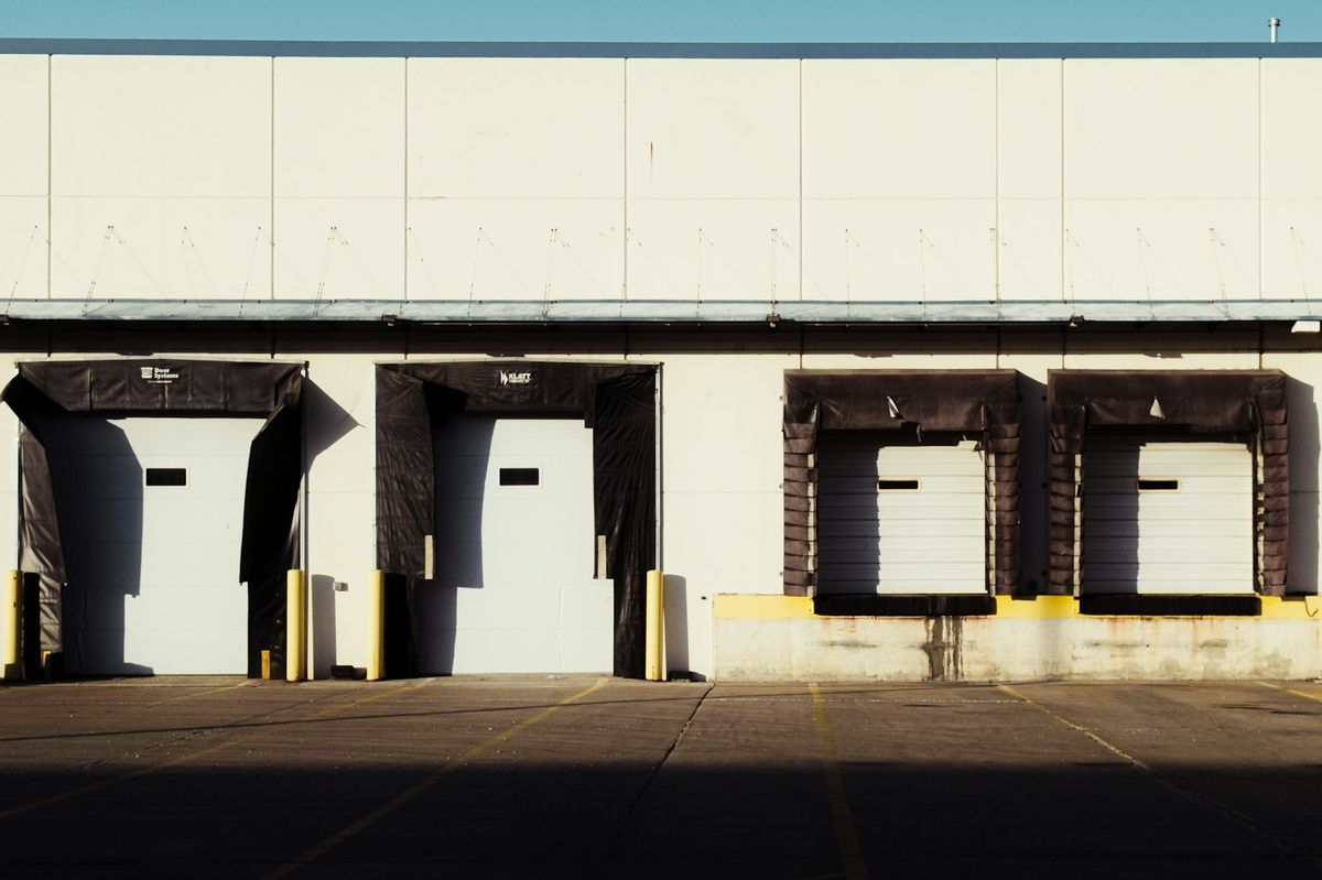 Trailers backed into a commercial warehouse loading dock